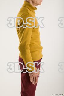 Arm flexing reference of yellow sweater red trousers Sidney 0011